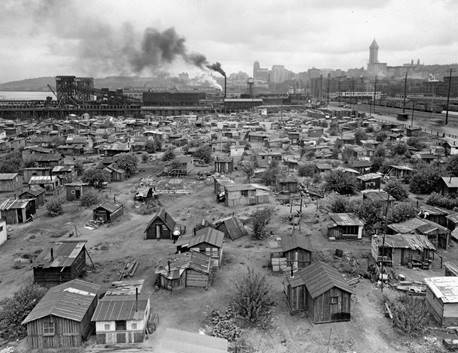 A shanytown, also known as a Hooverville (named for President Herbert Hoover), was located in Seattle, Washington, during the Great Depression. The photograph dates from about 1932 to 1937.