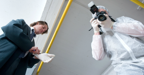 forensic scientist taking picture
