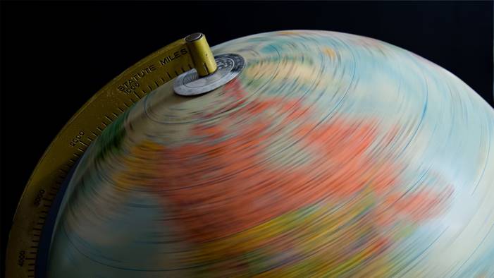 A close-up of a globe spinning quickly.