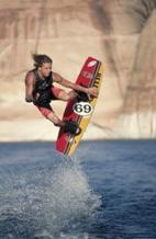 Photograph:Wakeboarder jumping a wake.